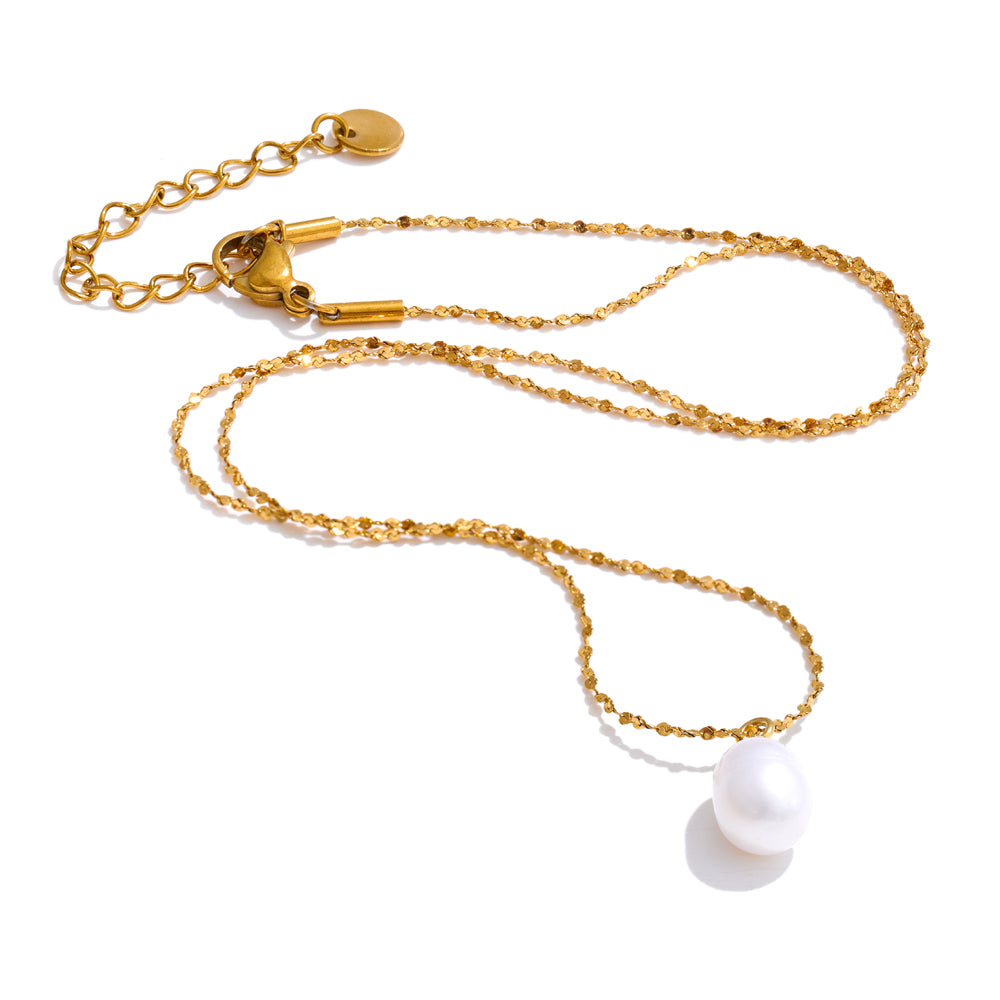 Gold chain lanyard with a white pearl charm on a white background