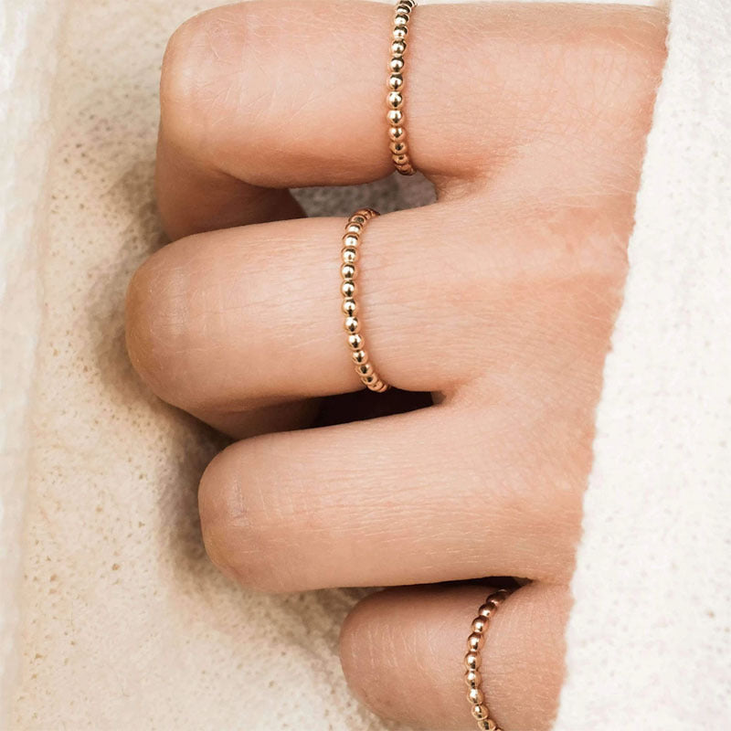18k gold plated dainty beaded ring on fingers
