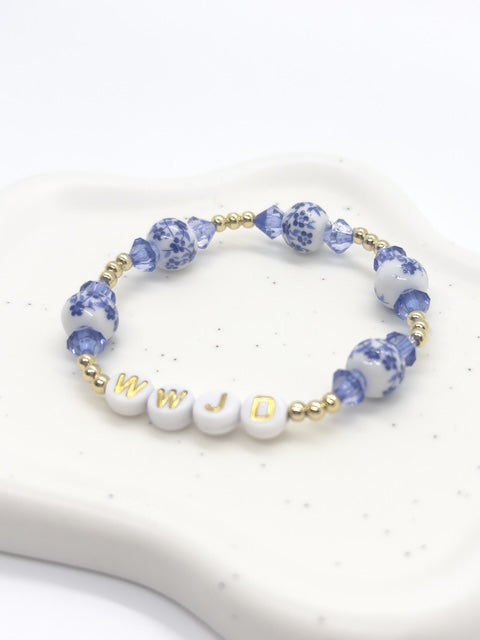 Handmade Bracelet with blue and white beads and gold accents 