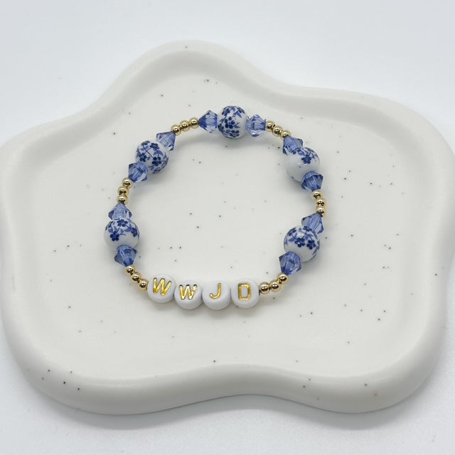 14k gold plated bracelet with blue and white ceramic beads and blue faceted acrylic beads