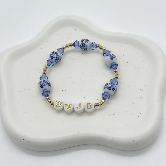14k gold plated bracelet with blue and white ceramic beads and blue faceted acrylic beads
