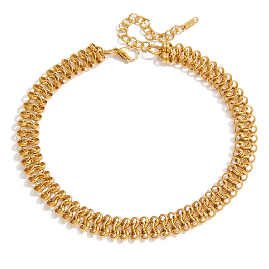 Gold chain necklace on a white background