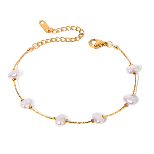 Gold plated dainty  pearl Bracelet on white background 