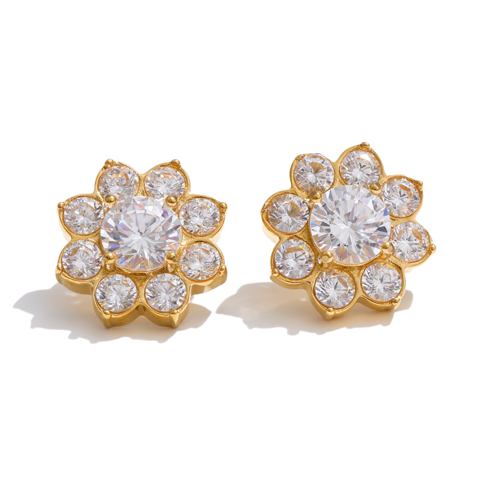 Pair of Bloom gold-plated flower stud earrings featuring a large round clear zircon center stone surrounded by eight smaller sparkling stones on a white background.