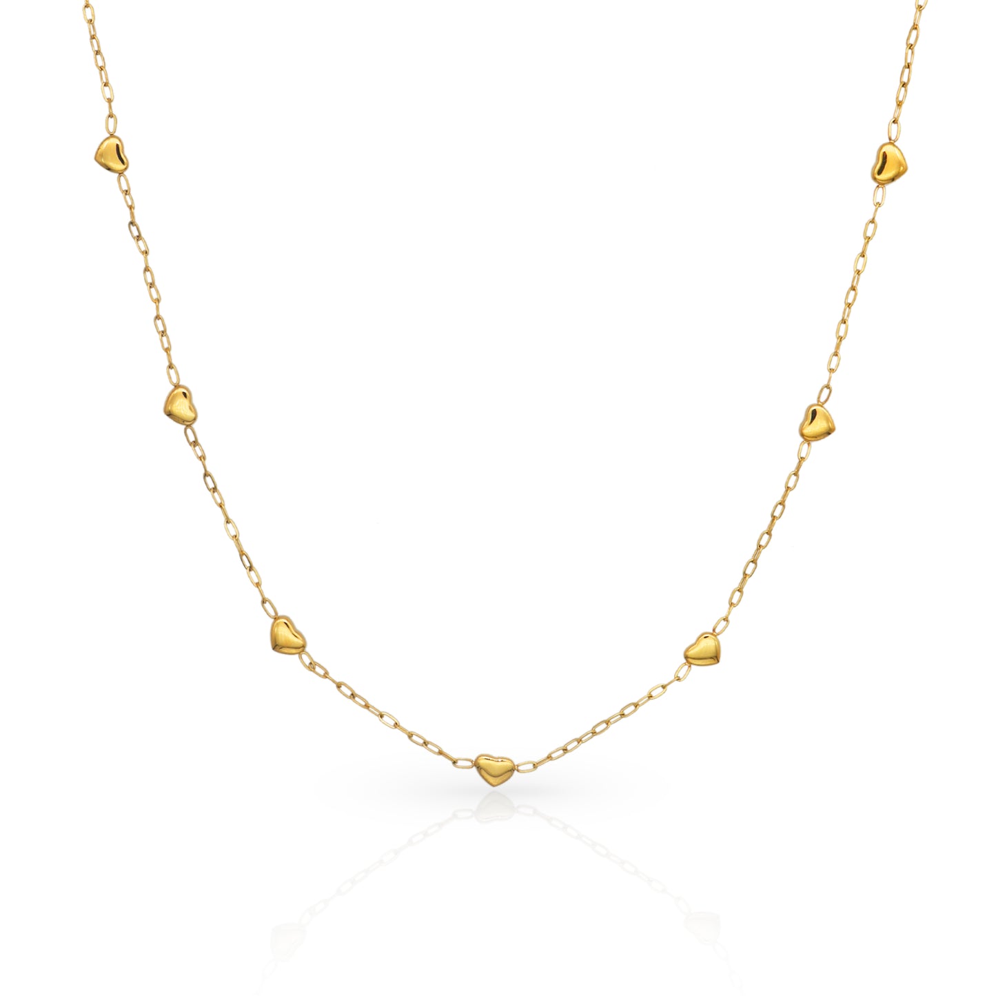 Gold necklace with heart-shaped pendants on a white background