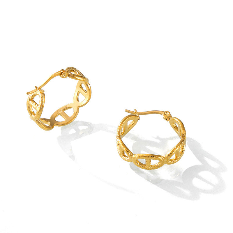 Pair of gold hoop earrings on a white background