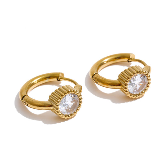 Gloria Earrings featuring sparkling round zircon stones in a gold beaded setting, with 18K gold-plated huggie hoops on a white background.