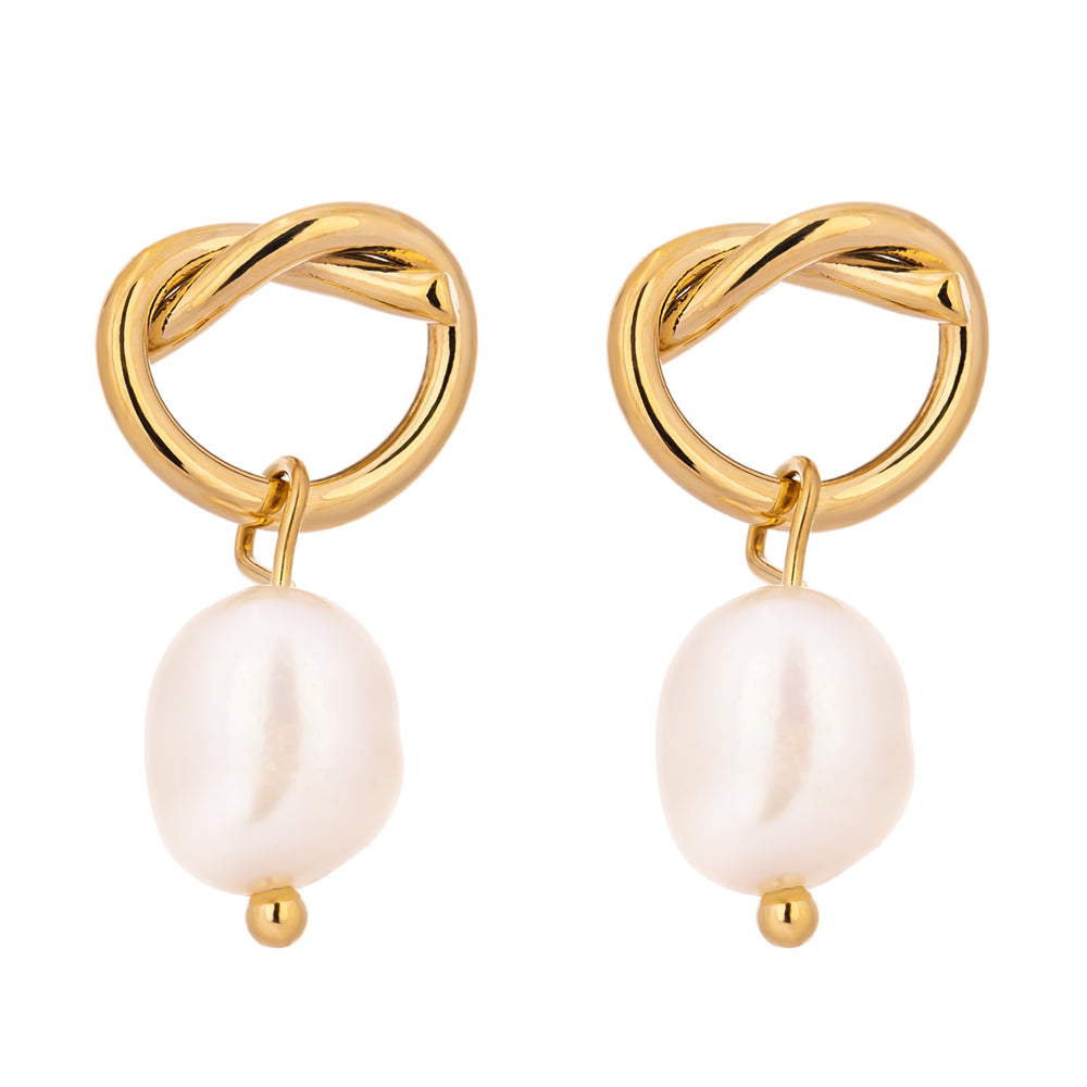 Gold earrings with interlocking rings and pearl drops on a white background