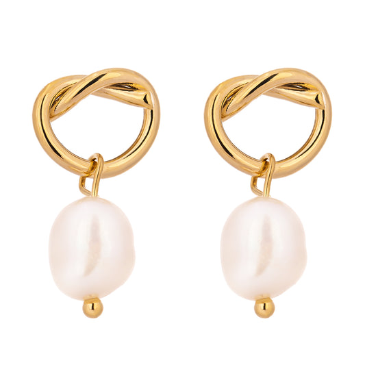 Gold earrings with interlocking rings and pearl drops on a white background