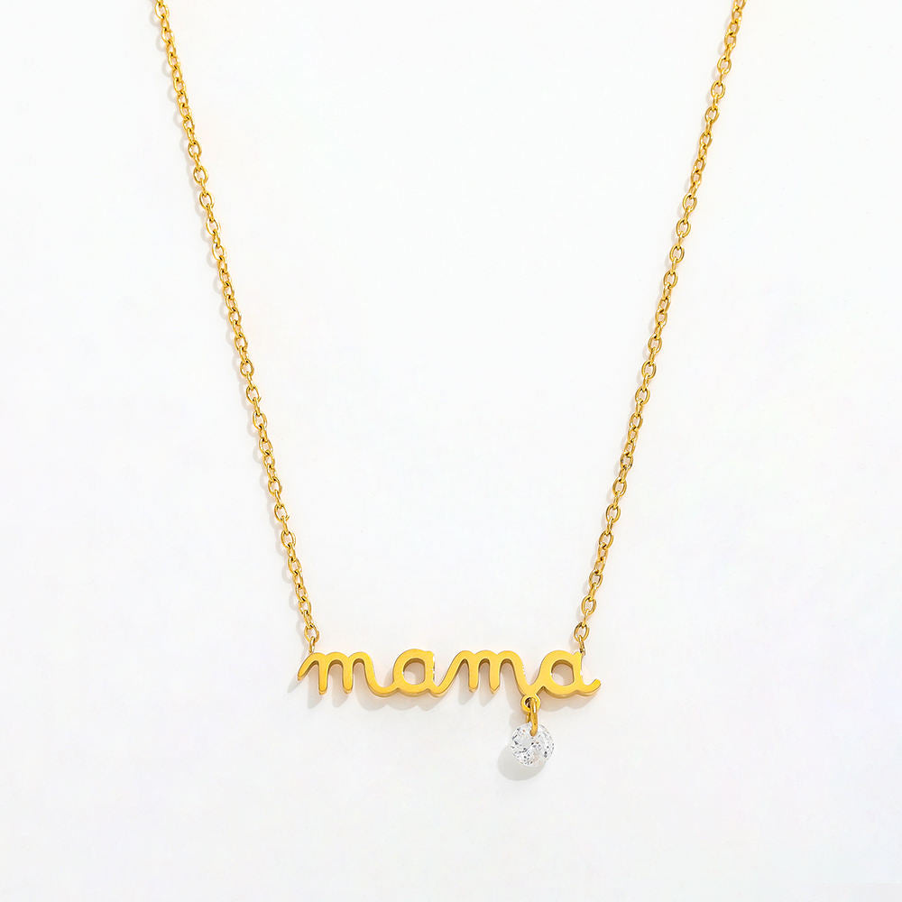 Gold 'mama' necklace with a crystal on a white background
