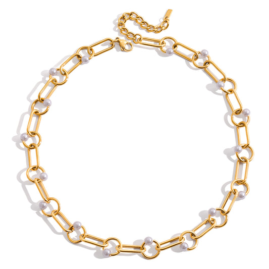 Gold chain necklace with white pearls on a white background