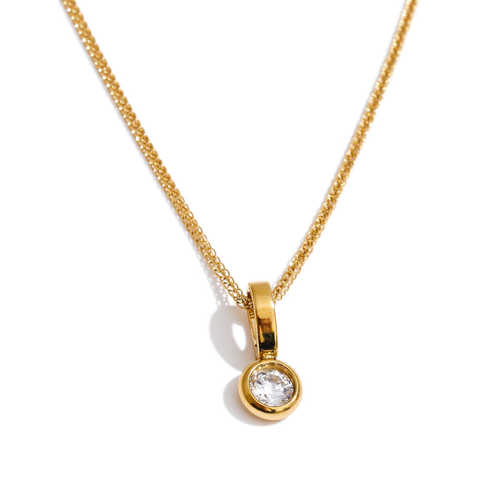 Hope Necklace featuring a sparkling round clear zircon stone in a polished 18K gold-plated setting on a delicate gold chain, photographed on a white background.