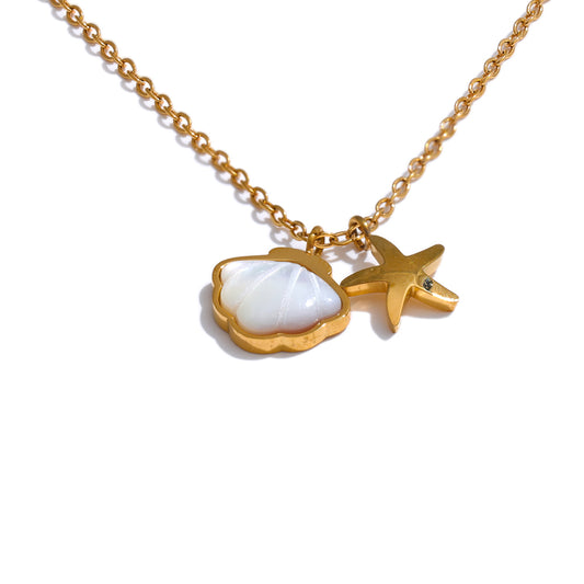 Gold necklace with a shell and starfish pendant on a white background