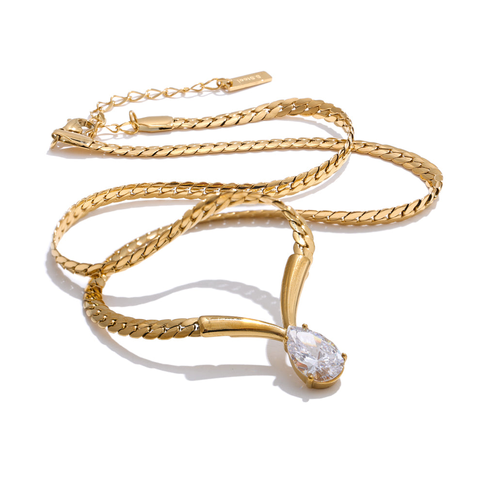Gold necklace with a diamond pendant on a white background