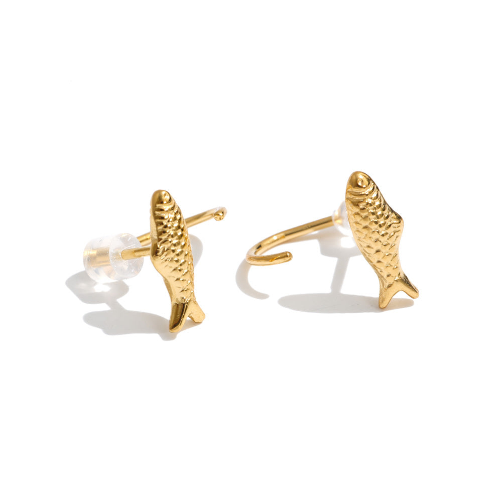 Pair of Faithful Fish Earrings featuring small textured gold fish designs, 18K gold-plated stud posts, and clear silicone earring backs on a white background.