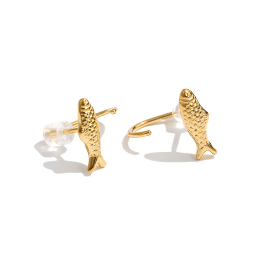 Pair of Faithful Fish Earrings featuring small textured gold fish designs, 18K gold-plated stud posts, and clear silicone earring backs on a white background.