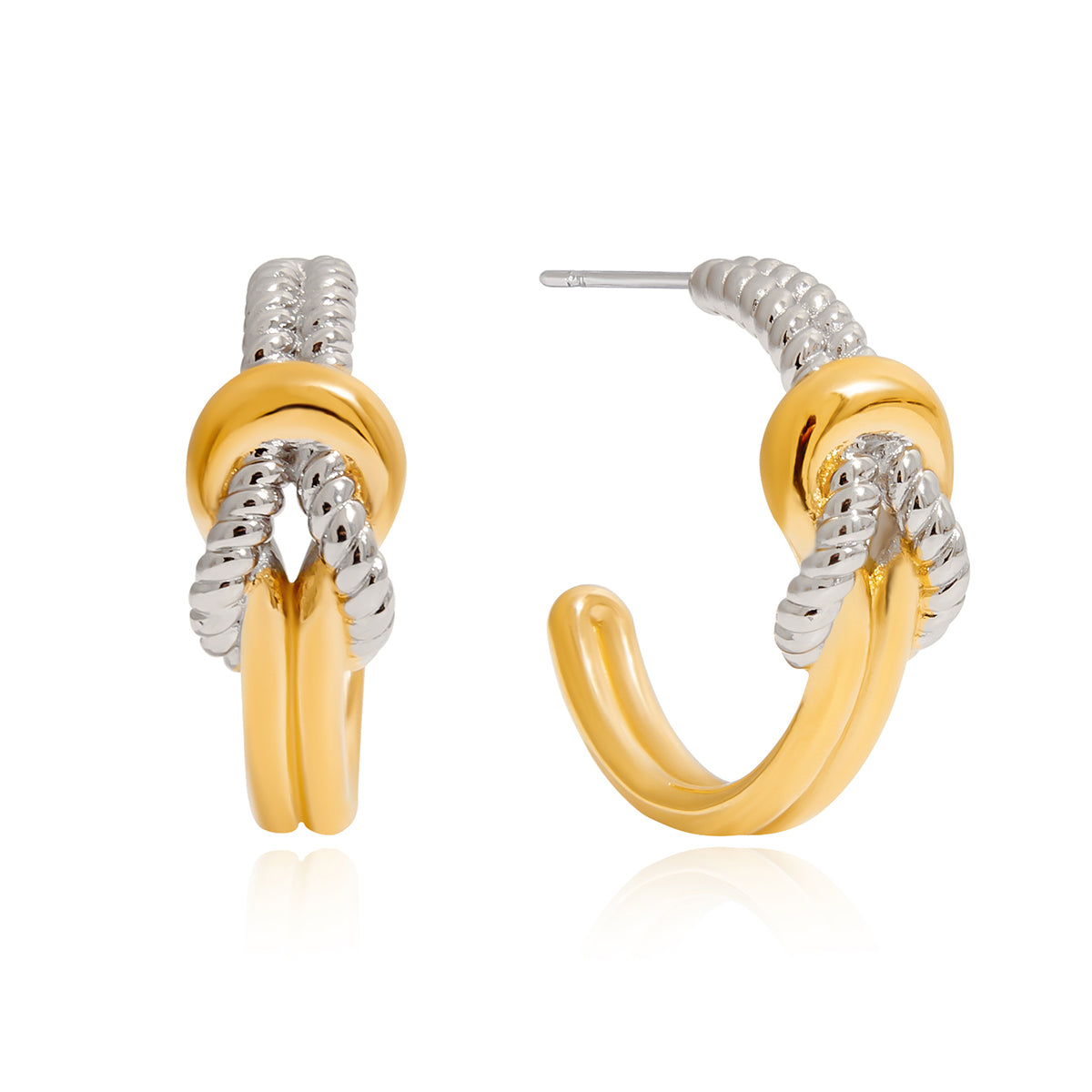 Gold and silver hoop earrings on a white background