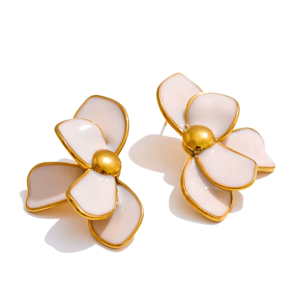 Flower-shaped earrings with gold accents on a white background