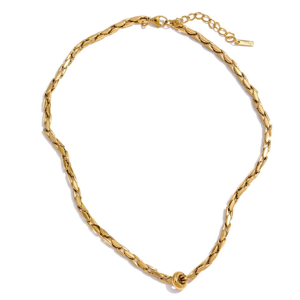 The Covenant Necklace with an 18K gold-plated woven chain, polished ring detail, and extender clasp on a white background.