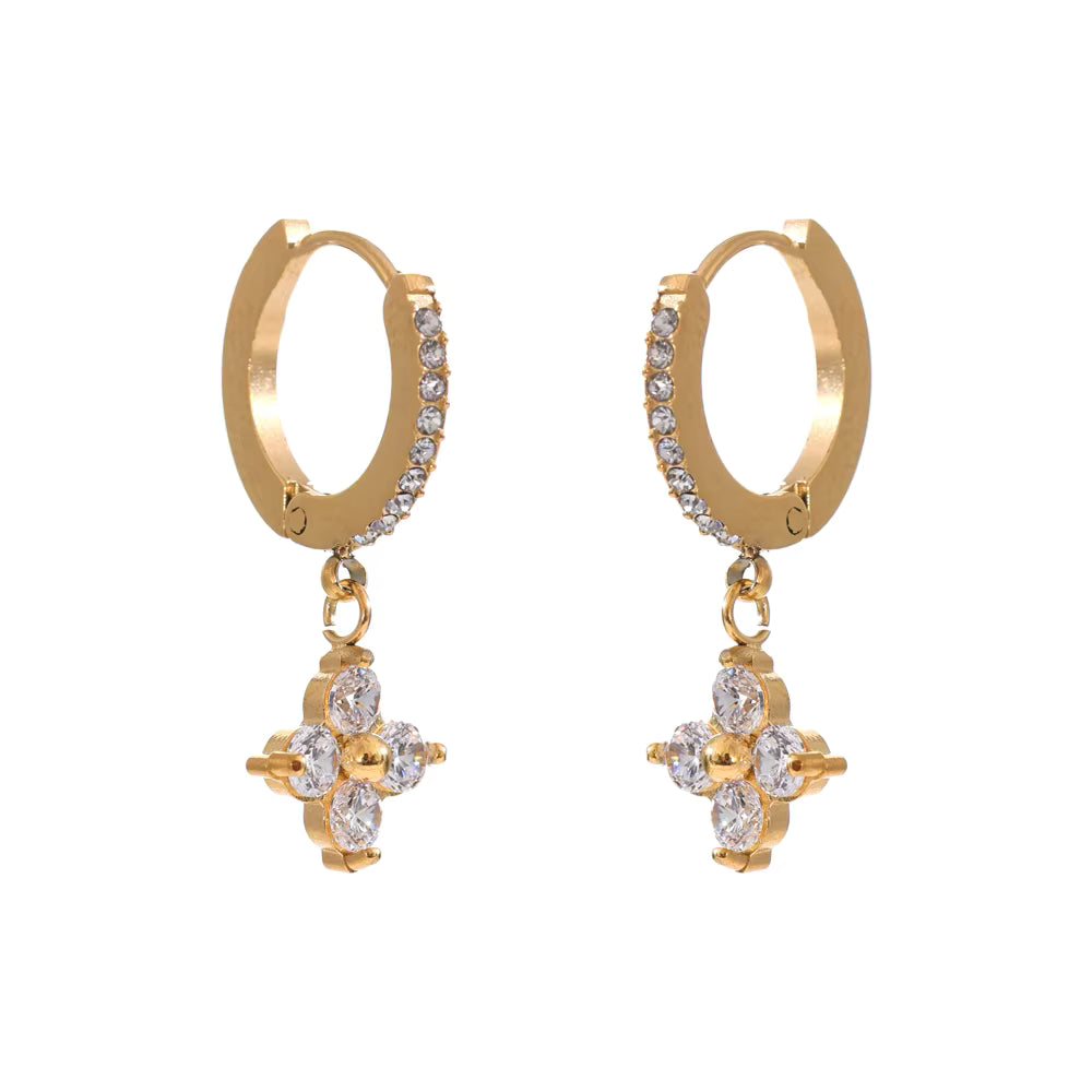 Gold hoop earrings with diamond-like stones on a white background