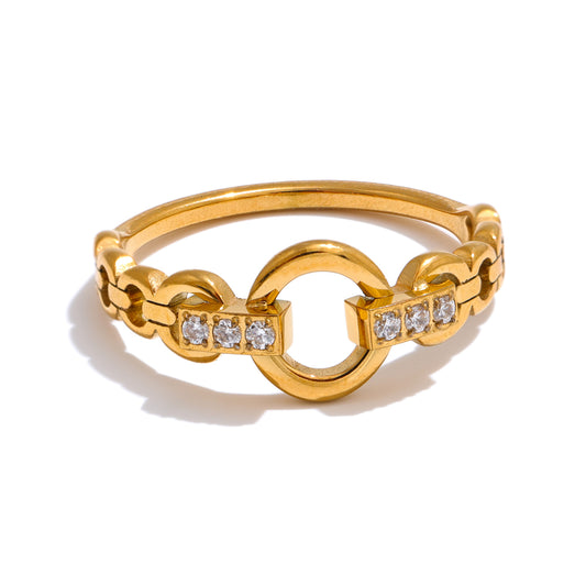 Gold ring with diamond accents on a white background